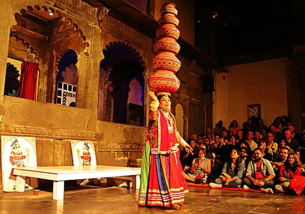 Bhavai dancer balancing a tower of pots at the Dharohar show, Bagore Ki Haveli