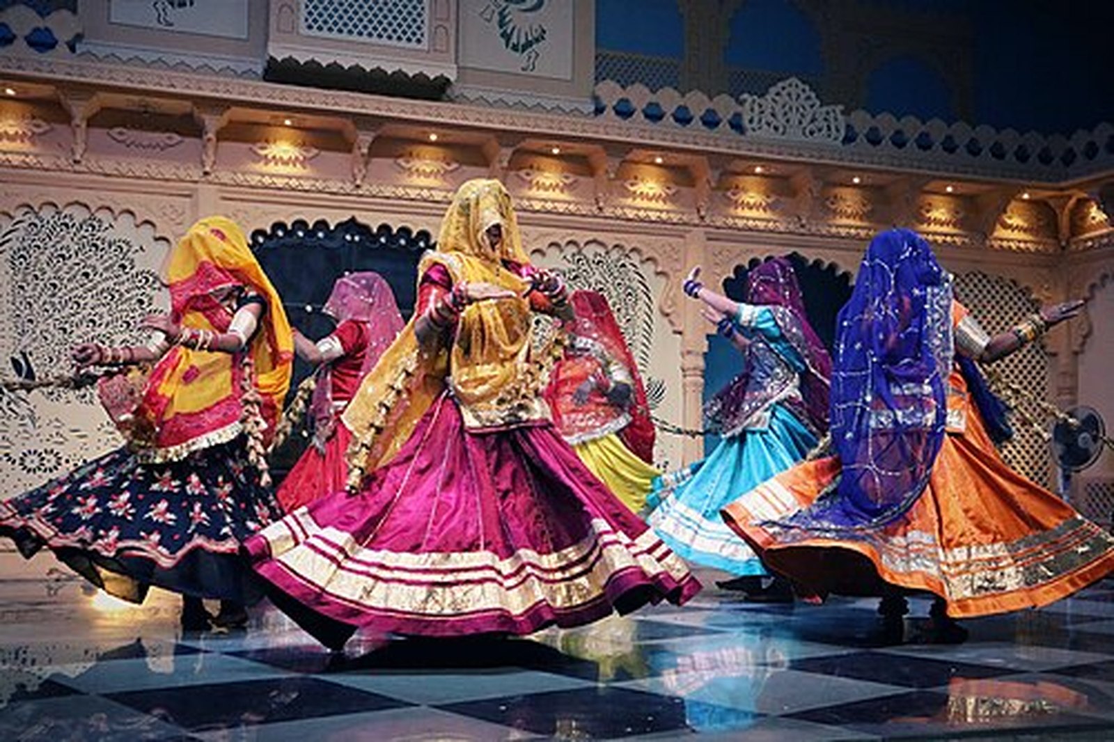 Ghoomar dancers swirling in colourful ghagras