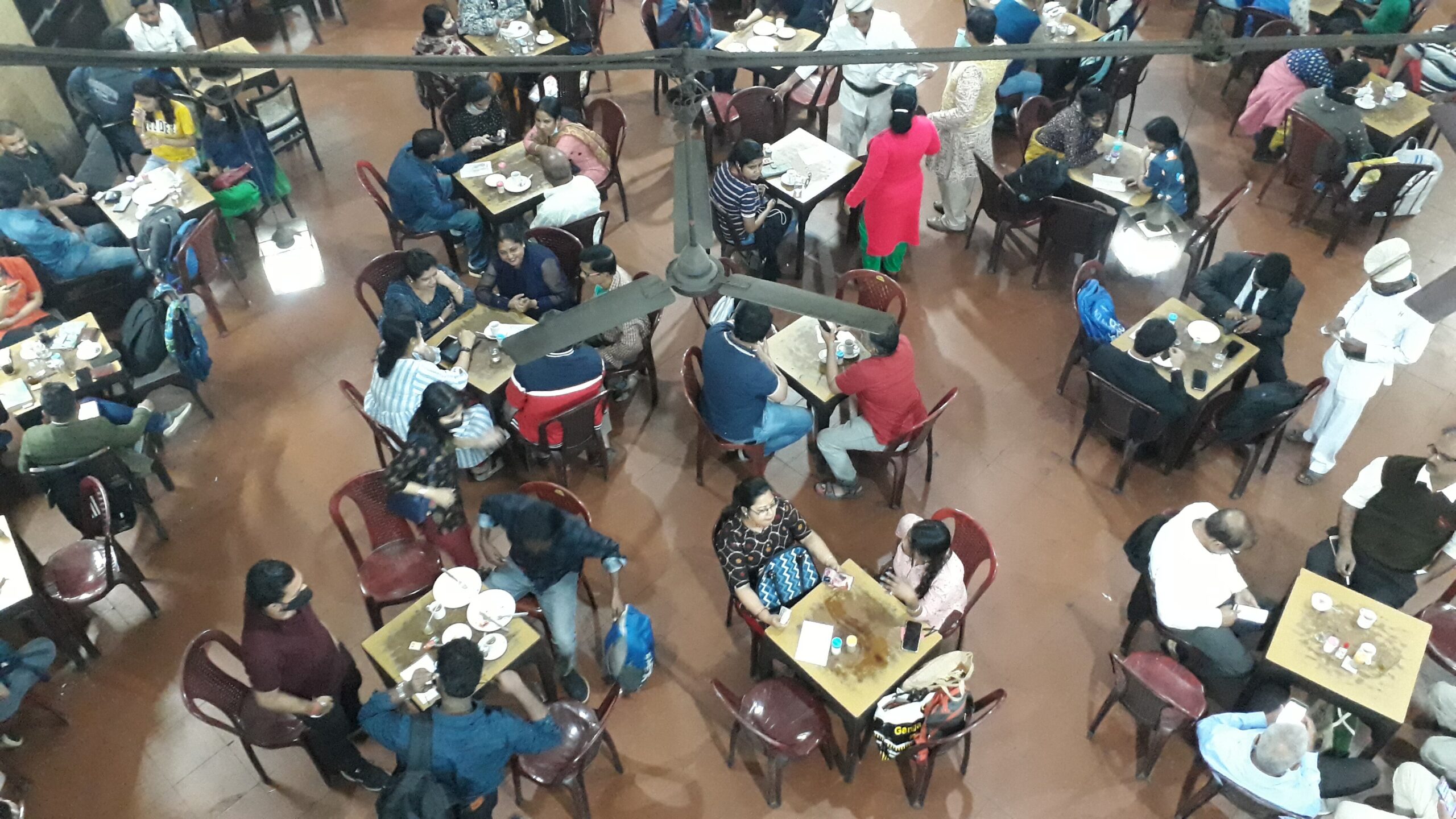 High-ceilinged hall of the Indian Coffee House on College Street