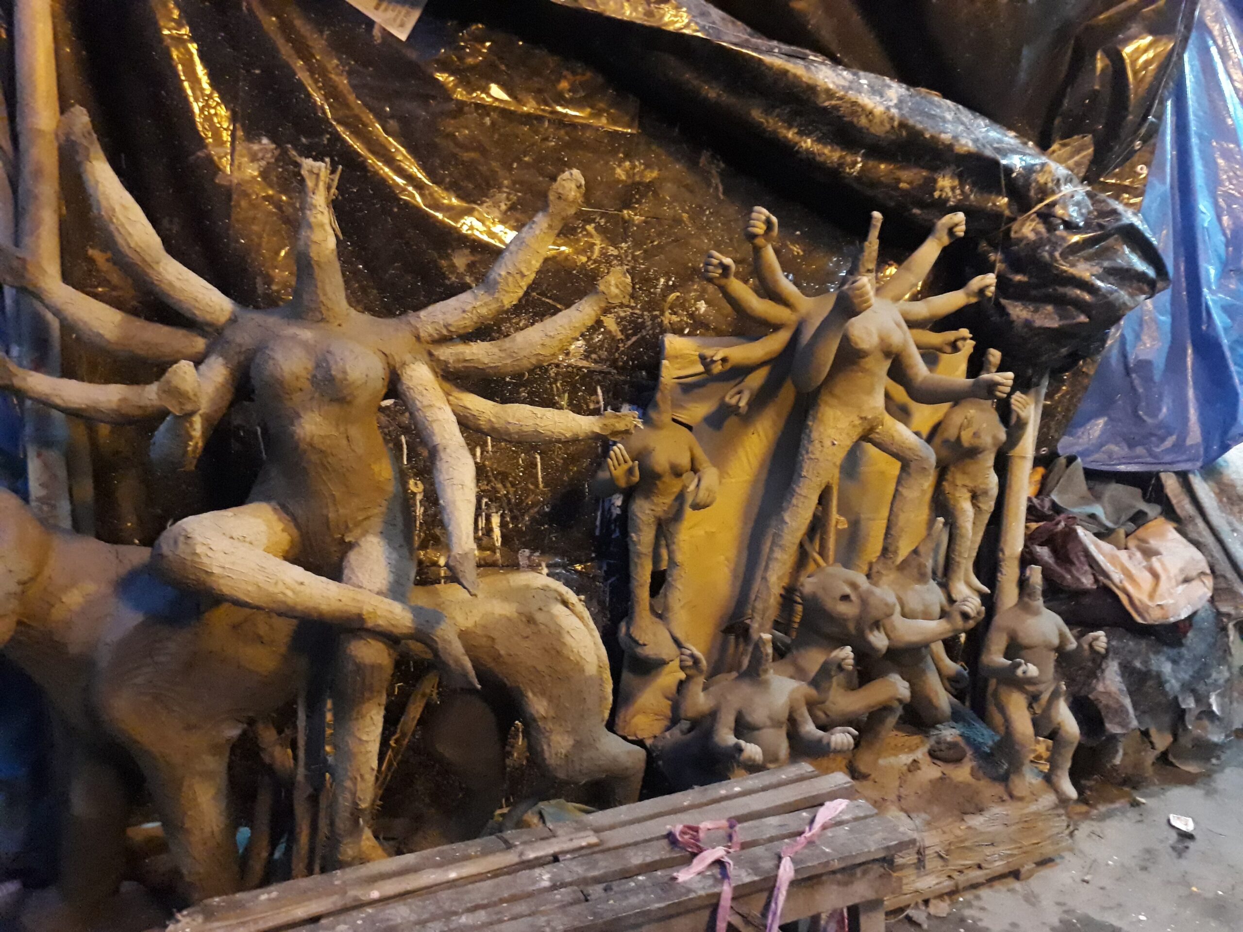Unfinished clay idols on straw frames in Kumartuli