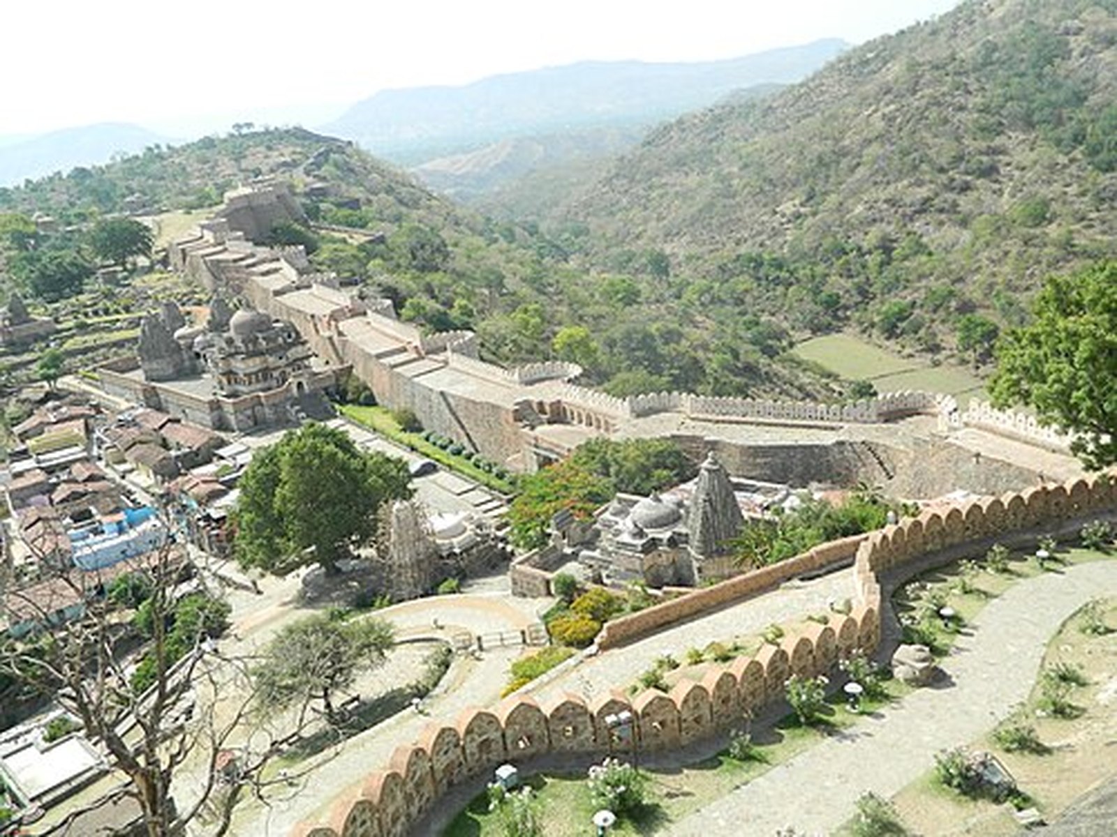 Kumbhalgarh Fort walls winding through green Aravalli valleys