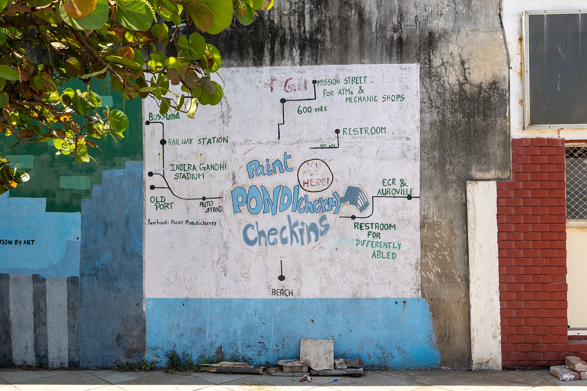 Hand-painted walking map of Pondicherry's streets on a wall in the French Quarter