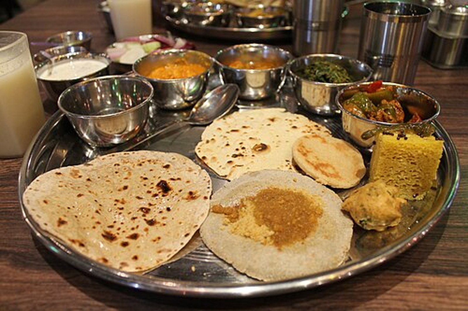 Rajasthani thali with bajra and wheat rotis, dal and ghee-rich curries
