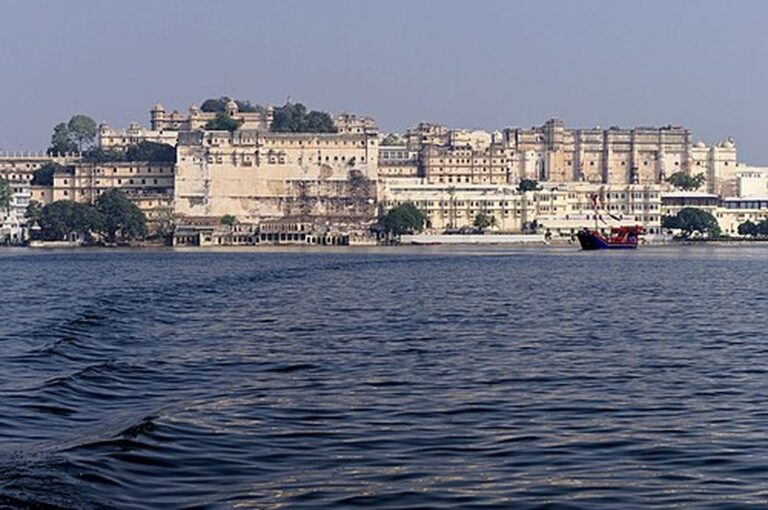 City Palace Udaipur seen across the waves of Lake Pichola