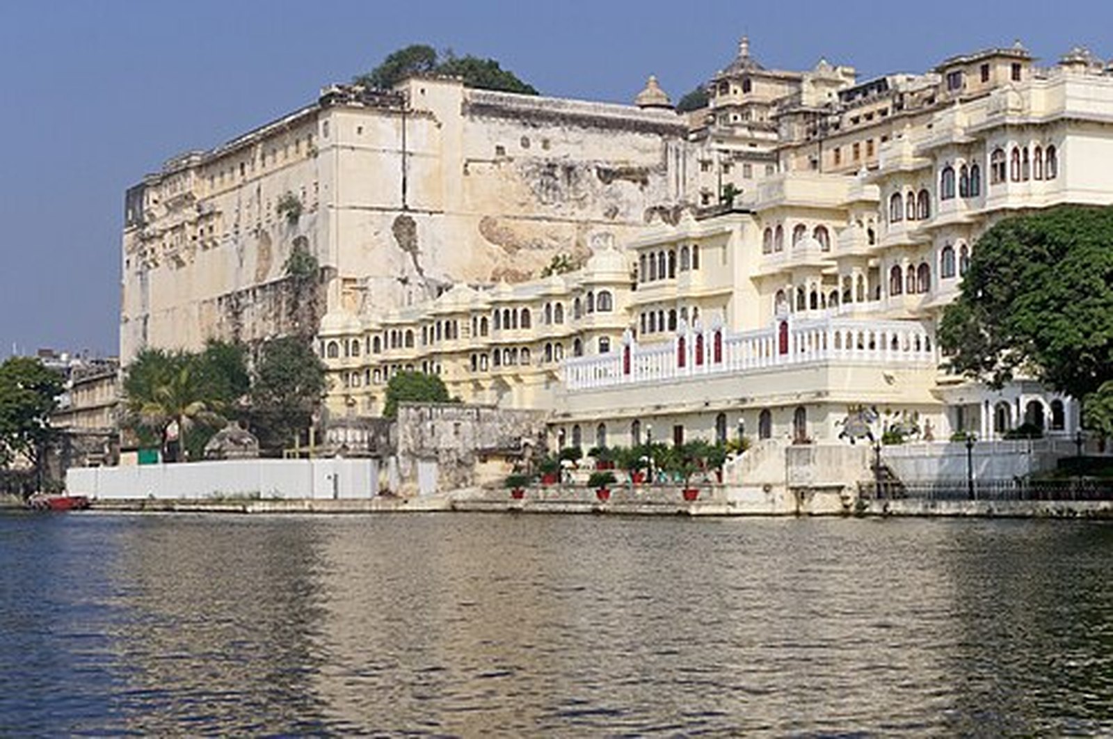 Towering walls of the City Palace rising from Lake Pichola, Udaipur