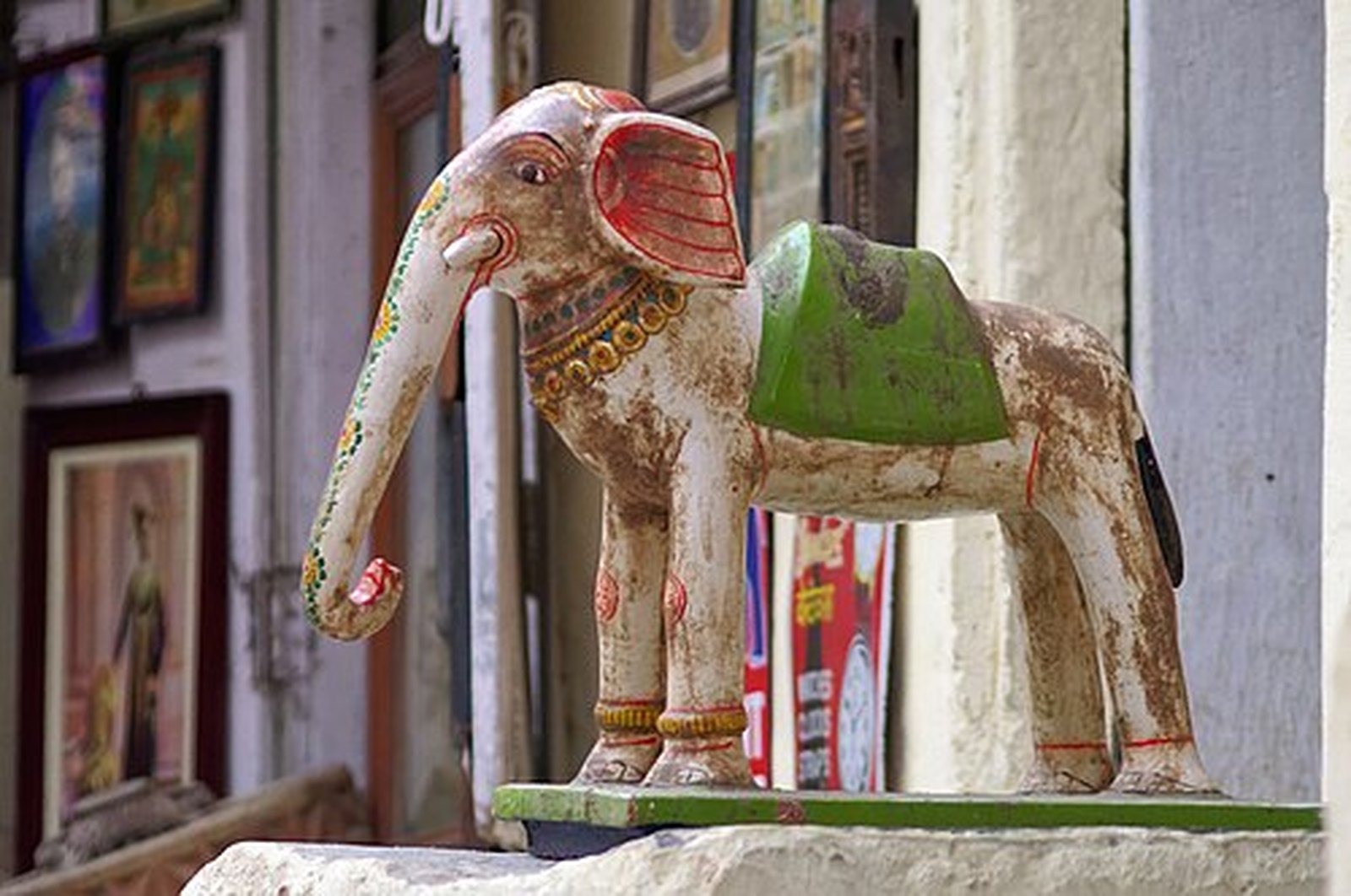 Hand-painted wooden elephant outside a craft shop in Udaipur old city