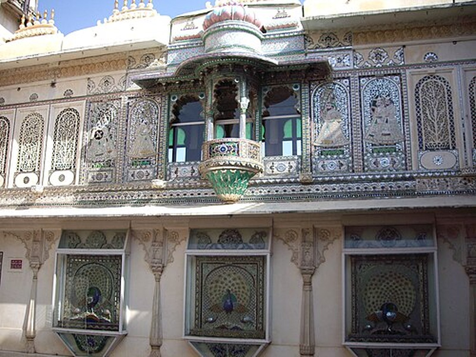 Projecting jharokha balcony with jali screens above the Mor Chowk, City Palace Udaipur
