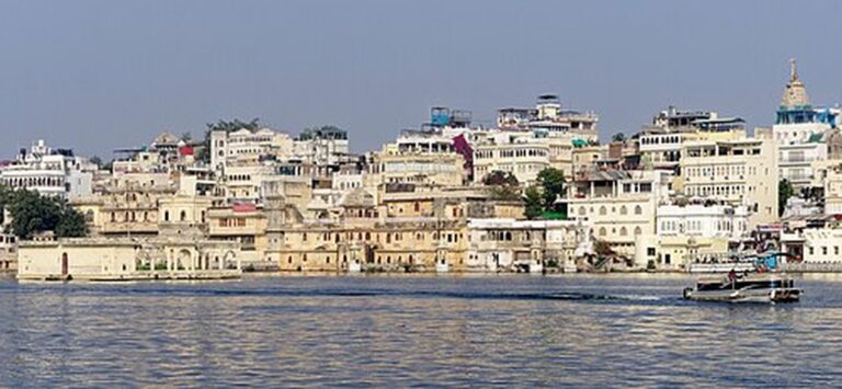 Whitewashed old city of Udaipur lining the shore of Lake Pichola