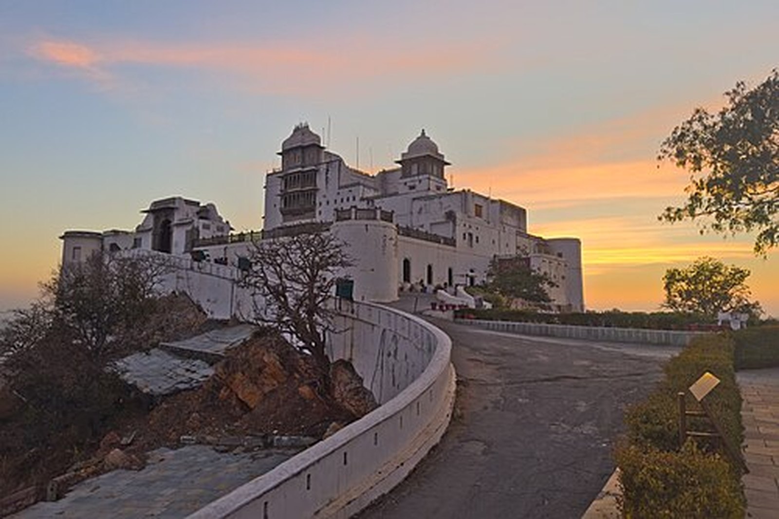 Sajjangarh Monsoon Palace at dusk on Bansdara hill above Udaipur